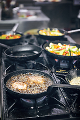 Image showing Cooking meat in a frying pan