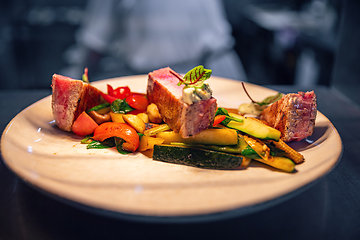 Image showing Beef steak slices with grilled vegetables