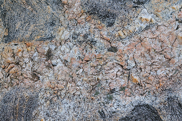 Image showing Detailed look at the natural patterns and colors of a granite rock surface.