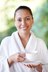 Image showing Woman, relax and portrait at spa with coffee, hotel and bathrobe from wellness and skincare treatment. Espresso, happy and smile from tea cup and health with hospitality at lodge with luxury and care