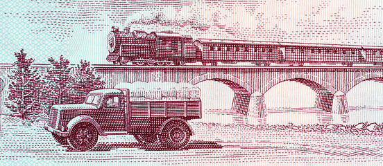 Image showing Truck and steam passenger train crossing viaduct