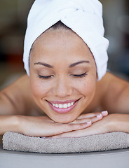 Image showing Spa, woman and relax on massage bed with smile for wellness, zen and beauty treatment for body care. Person, sleeping and physical therapy at resort, salon table and luxury on holiday or vacation