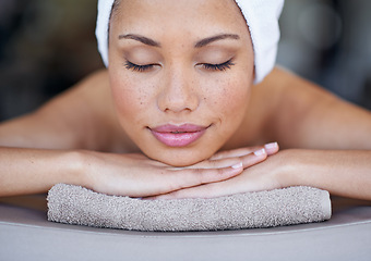 Image showing Spa, woman and sleeping on massage bed with smile for wellness, zen and beauty treatment for body care. Person, relax and physical therapy at resort, salon table and luxury on holiday or vacation