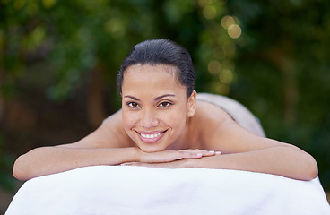 Image showing Spa, woman and portrait on massage bed with smile for wellness, zen and beauty treatment for body care. Person, relax and physical therapy at resort, salon table and luxury on holiday or vacation