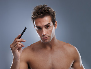 Image showing Man, portrait and comb hair for style or grooming on grey background for hygiene, self care and shirtless. Male person, model and face with brush for routine in morning, confidence or mockup space