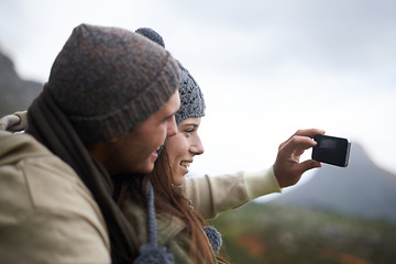 Image showing Happy couple, hiking selfie and mountains for travel, journey and adventure with photography and memory of love. People with hug and smile in profile picture for trekking in winter and nature tourism