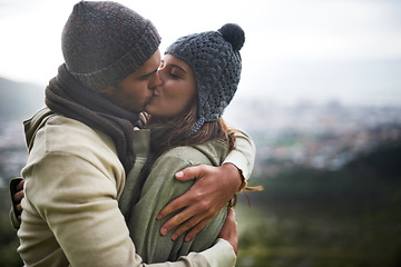 Image showing Couple, kiss and romance outdoor with hug for bonding, love and relationship with travel or holiday. Man, woman and face with embrace or smile on vacation, trip and carefree with mockup space or care