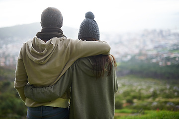 Image showing Nature view, hug and couple looking at city on hiking journey, travel adventure or mountain climbing trip. Marriage, embrace and back of woman, man or people together for bonding, wellness and love