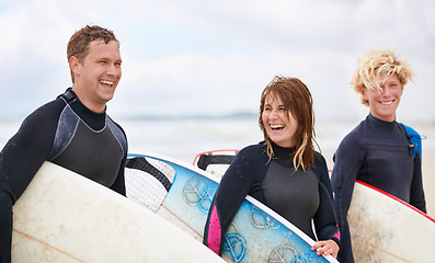 Image showing Friends laugh, surfboard and ocean with surfing, fitness and exercise by the sea and beach. Group, outdoor and surfer with travel, training and water on vacation and holiday in Miami with freedom