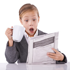 Image showing Young child, reading and newspaper headlines in studio with shock for business, coffee and surprise of daily events. Little girl, suit or thinking by mug as pretend professional or white background