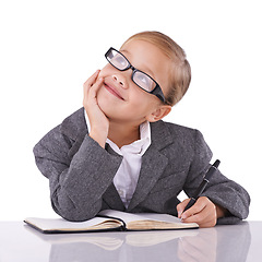 Image showing Young child, writing and dreaming in studio for business, career and happy with idea of office job. Little girl, suit or positive for future as pretend accountant or cute glasses by white background