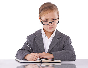 Image showing Business person, notebook and child in portrait, writing ideas and planning tasks in studio. Serious female person, pretend employee and journal for notes, schedule and diary on white background