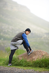 Image showing Fitness, stretching and portrait of a man in nature for training, running and a workout. Health, start and a male runner or athlete with a warm up in the road for a competition, cardio or exercise