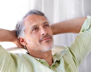 Image showing Relax, mature man and thinking on chair with wellness, idea and peace in home for holiday. Happy person, thought and calm for rest on weekend, morning and positive memory on vacation in apartment