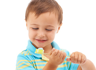 Image showing Boy child, toothpaste and toothbrush in studio with smile for health, cleaning and hygiene by white background. Kid, thinking and happy for choice, learning and brushing teeth for dental wellness