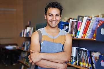 Image showing Portrait, arms crossed or happy man in library for education or development for future growth. Scholarship, knowledge or male student with smile or books for studying or learning in college campus