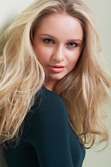 Image showing Hair care, portrait and woman in studio with growth, texture or volume on wall background. Face, hairstyle and female beauty model pose with shampoo, treatment or conditioner, shine for results