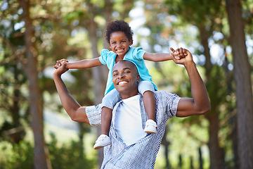 Image showing Man, child and portrait on shoulders in forest for hiking nature path, weekend explore or vacation journey. Black person, daughter and hug embrace for holiday love together, woods travel or sunshine
