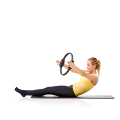 Image showing Woman, pilates ring and yoga mat for balance exercise or resistance training, strong core or studio white background. Female person, equipment for muscle wellbeing or abs workout, health or mockup