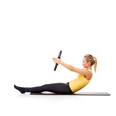 Image showing Woman, pilates ring and arms for balance stretching on yoga mat or resistance health, roll up or studio white background. Female person, equipment for muscle flexibility, wellness strength or mockup