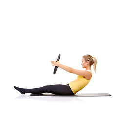 Image showing Pilates ring, fitness and woman exercise in studio isolated on a white background mockup space. Training, person on mat and magic circle for roll up, strong abdomen and healthy body workout on floor