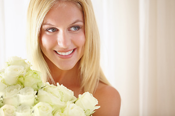 Image showing Face, smile or thinking and woman with flowers closeup in her home for romance on valentines day. Beauty, rose bouquet and a happy young blonde woman in her apartment for anniversary celebration