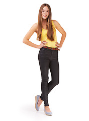 Image showing Fashion, confident and portrait of girl on a white background for positive attitude, happy and style. Hands on hips, youth and isolated teenager in trendy clothes, casual outfit and stylish in studio