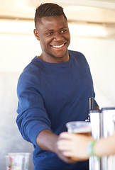 Image showing Smile, party and a black man bartender serving drinks outdoor at an event, festival or celebration. Beer, alcohol and carnival with a happy young person at a bar in a tent for beverage service