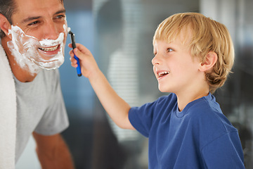 Image showing Help with shaving, dad and child with razor, cream on face and bonding in home with morning routine. Teaching, learning and father with happy son in bathroom for love, clean fun or grooming together