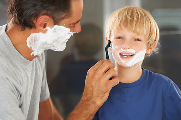 Image showing Shaving, dad and child with cream, razor on face and bonding in home with morning routine. Teaching, learning and father with happy son in bathroom for facial, clean fun and grooming together.