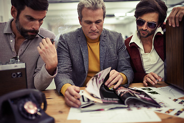 Image showing Businessman, group and magazine design planning in a retro creative agency with strategy. Idea, brainstorming and vintage male people with media publishing and graphic samples for journalism