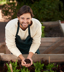 Image showing Portrait, farmer and man with soil for agriculture, smile and ecology for sustainability of nature. Face, gardener and happy person with fertilizer, earth and dirt for growth of plants in environment