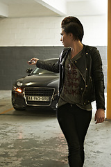 Image showing Woman, parking and lock car with cool punk style in garage for safety at home. Underground, vehicle and female person with button for security with edgy fashion and driving trasnportation and trip