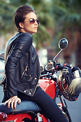 Image showing Motorcycle, road trip and woman thinking in city with sunglasses for travel or transport as rebel. Fashion, street and person with attitude on classic or vintage bike for transportation or journey