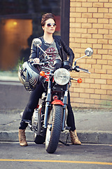 Image showing Motorcycle, leather and woman on street with sunglasses for travel, transport or road trip as rebel. Fashion, city and model with attitude on classic or vintage bike for transportation or journey