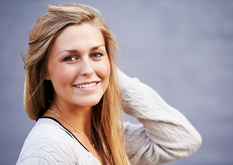 Image showing Beauty, portrait and happy woman by wall in city, outdoor and background. Face, fashion and smile of young attractive person, stylish casual clothes or facial expression of blonde girl in Switzerland