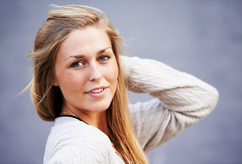 Image showing Beauty, portrait and confident woman by wall in city, outdoor and background. Face, fashion and young person in urban town, stylish casual clothes or facial expression of blonde girl in Switzerland