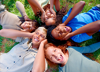 Image showing Children, friends and cover ears in nature for silence, quiet and ignoring noise in outdoors. Diversity, kids and laugh for humor or funny joke on grass, top view and bonding or playful in childhood