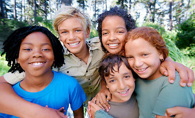 Image showing Children, friends and hug in portrait on outdoor adventure, support and bonding on camping trip. Diversity, kids and smiling in embrace for love, together and happy in forest or woods on vacation