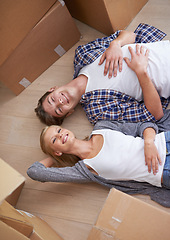 Image showing Couple, floor and moving or boxes for relax from packing or real estate property or bonding, marriage or apartment. Man, woman and rest for investment loan or mortgage for relocation, rent or buy