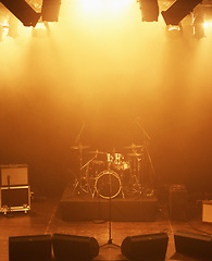 Image showing Concert, band and drums at stage for performance with instruments for live sound or gig. Music festival show, ready or background with lights or speakers in an empty theater at night for a rock event