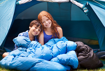 Image showing Portrait, camping and children hug in a tent sleeping bag with love, care and bonding in nature together. Happy family, kids and siblings wake up outdoor with trust, games and fun on forest sleepover