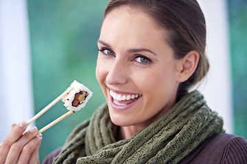 Image showing Woman, eating sushi and healthy food in portrait, lunch or dinner, Japanese cuisine and seafood with chopsticks. Catering, hungry and diet, relax with meal at home and happy with dish for nutrition