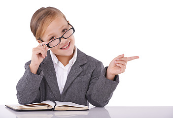 Image showing Business, pointing and child in studio portrait, ideas and planning for company growth. Female person, pretend employee and journal for strategy, schedule and diary checklist on white background