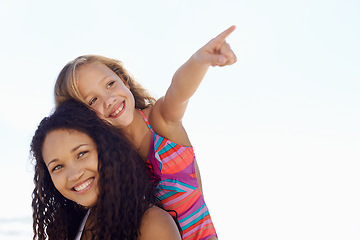 Image showing Happy mother, child and pointing on piggyback at beach for exploring or sight on mockup space. Face of mom, daughter or kid smile for vision, adventure or looking in a distance on a sky background