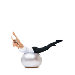 Image showing Woman, ball or balance on studio space for workout, wellness or mobility exercise on white background. Female athlete, training equipment or fitness for mockup, stretching legs or body flexibility