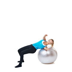 Image showing Portrait, fitness and happy woman stretching on an exercise ball in studio on white background. Gym, mockup and female person with inflatable for flexibility, training or balance, sports or workout