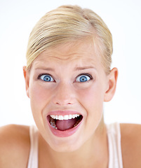 Image showing Portrait, screaming and woman scared, surprise and yelling isolated on a white studio background. Face, shouting and blonde person in horror, stress facial expression and fear, shocked and afraid