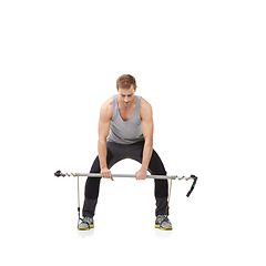 Image showing Exercise, gym and resistance band with a strong man in studio isolated on a white background for health. Fitness, workout or performance and a young athlete training with equipment for wellness