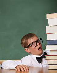 Image showing Child, surprise and portrait with stack of books in classroom for education, language learning and knowledge. Kid or student in glasses and shocked or wow for school, reading list and study mockup